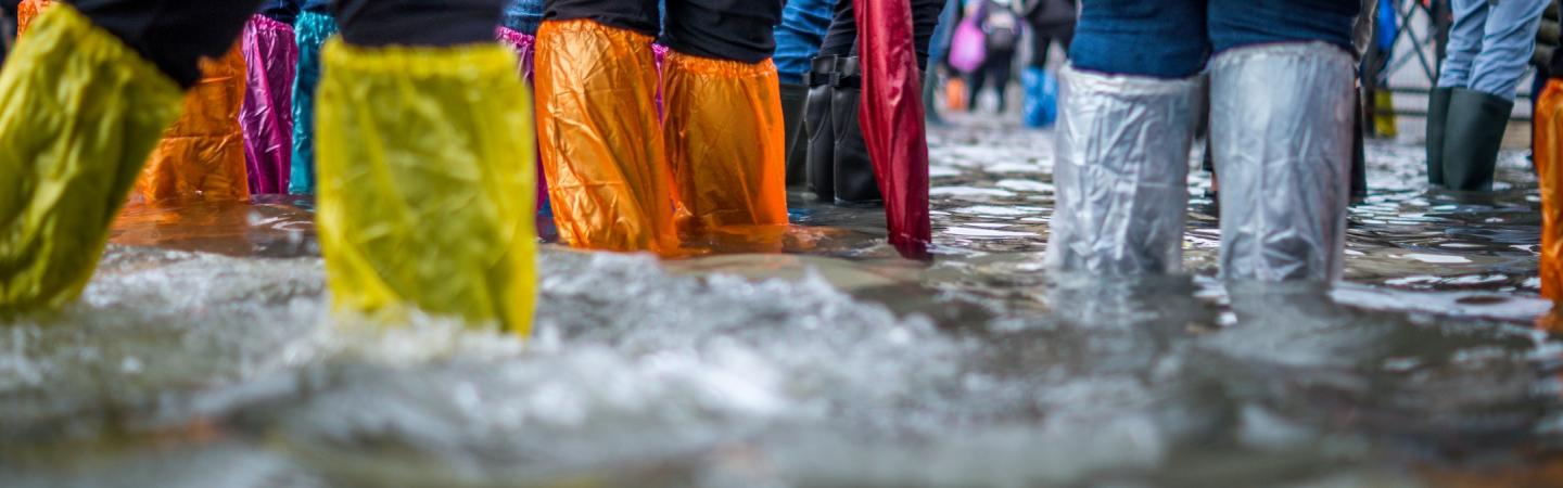 keeping dry during a flood in Venice, Italy