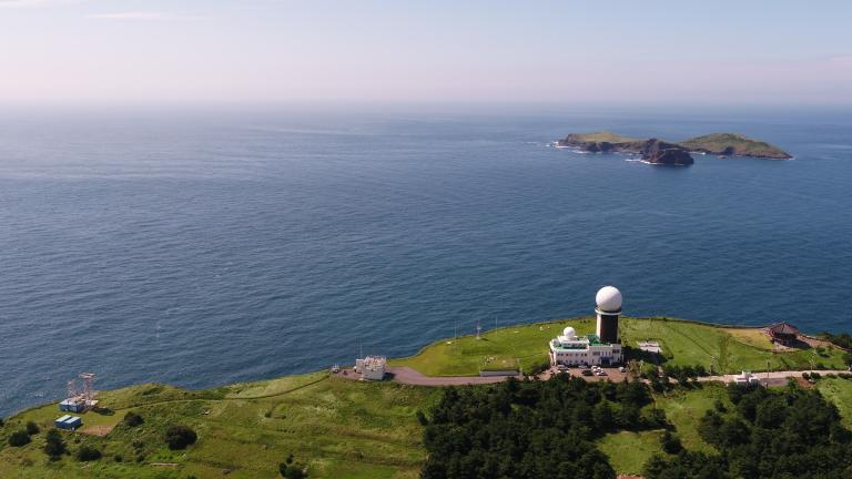 An aerial view of the Gosan Observatory, including the AGAGE station in Gosan, South Korea (lower left), which takes hourly measurements of more than 50 trace gases, including CFC-11.