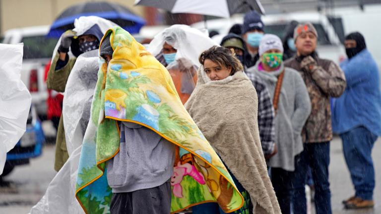 Texans waiting in the rain