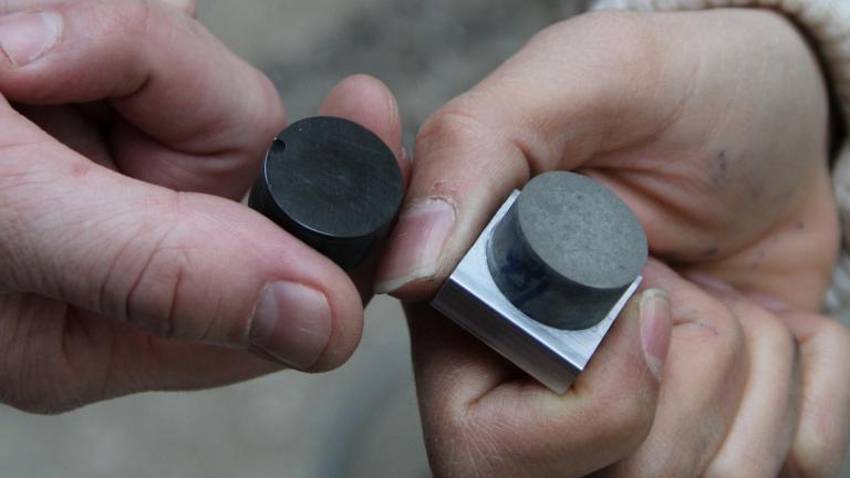 MIT CSHub postdocs Nicolas Chanut and Nancy Soliman hold two of their conductive cement samples. 