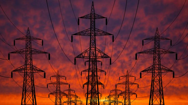 Transmission lines with backdrop of sunset