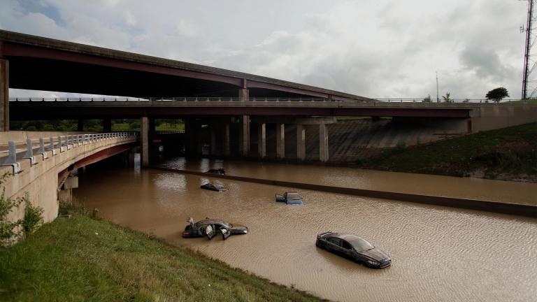 Abandoned cars are flooded with water after a 2014 storm in Detroit.