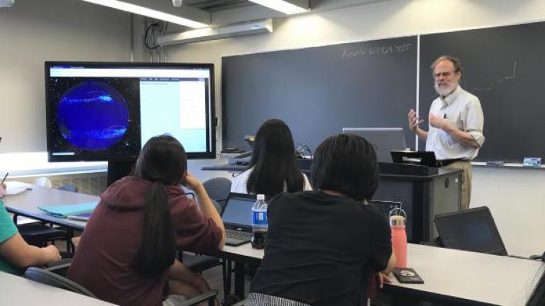 Lecturer addressing students in classroom