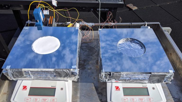 Two samples of passive cooling devices were tested on the roof of MIT's Building 1: On the left, a sample of the new system, combining evaporative cooling, radiative cooling, and insulation. On the right, a device using just evaporative cooling, for comparison testing.