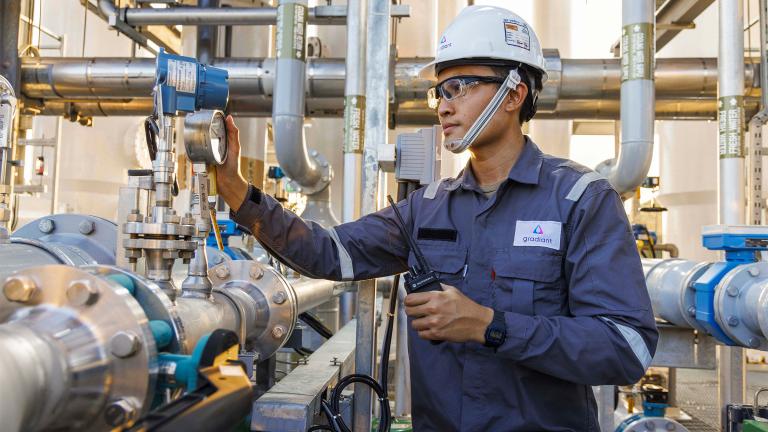 The mission of Gradiant, a firm started by MIT alumni, is to preserve water for generations to come in the face of rising global demand through innovation. Here, a worker inspects a Gradiant water treatment system.