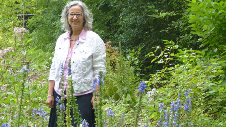 Debbi Edelstein standing in a field 