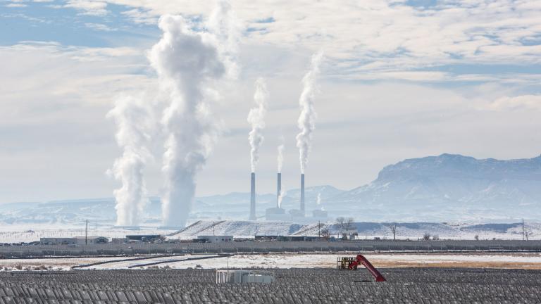 a solar plant being installed in front of Huntington Power Plant in Emory County, Utah