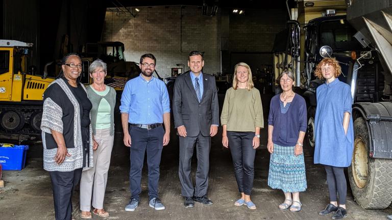 The Malden Works team gathered in the Malden, Massachusetts, Department of Public Works garage during a recent site tour: (left to right) Marcia Manong, Karen Buck, Evan Spetrini, Gary Christenson, Amber Christoffersen, Kathleen Vandiver, and Marie Law Adams.