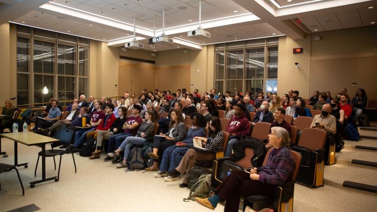 Attendees examine the ideas and information under discussion during the first "Civil Discourse" event at MIT. 