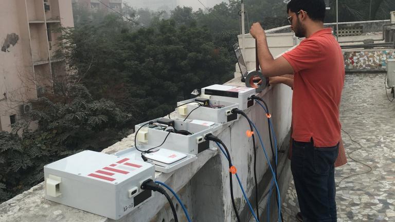 Graduate student Sidhant Pai repairs low-cost air quality sensors near Connaught Place in Central Delhi.