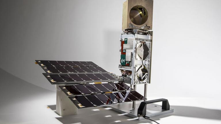 The TROPICS Pathfinder satellite, pictured here, was launched on June 30. The satellite body measures approximately 10 cm X 10 cm X 36 cm and is identical to the six additional satellites that will be launched in the constellation in 2022. The golden cube at the top is the microwave radiometer, which measures the precipitation, temperature, and humidity inside tropical storms.