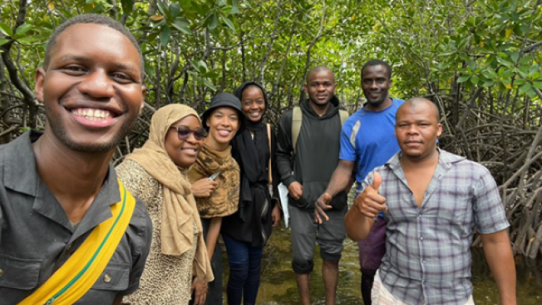 Researchers from the State University of Zanzibar and MIT students Mel Isidor (third from left) and Rajan Hoyle (far left) enjoy a field visit to Uzi Island, Zanzibar, to learn about seaweed farming.