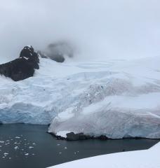 Glacier breaking off into ocean