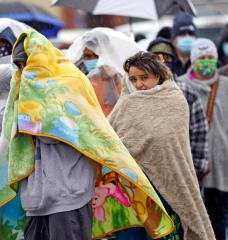 Texans waiting in the rain