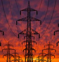 Transmission lines with backdrop of sunset