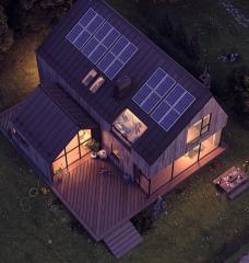 Aerial view of home with rooftop solar panels at night