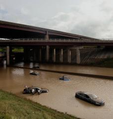 Abandoned cars are flooded with water after a 2014 storm in Detroit.