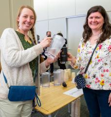 Hosted by MIT’s Department of Mechanical Engineering, the Health of the Planet Showcase on April 4 was the first such event where support and administrative staff were invited to present their research efforts alongside students, faculty, and postdocs. Here, Theresa Werth (left), program manager in MIT MechE, and Dorothy Hanna, program administrator in MIT MechE, present their work on reducing bottled water use and practical strategies developed by staff to overcome functional barriers on campus.