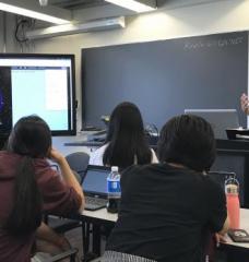 Lecturer addressing students in classroom