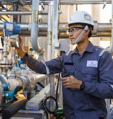 The mission of Gradiant, a firm started by MIT alumni, is to preserve water for generations to come in the face of rising global demand through innovation. Here, a worker inspects a Gradiant water treatment system.