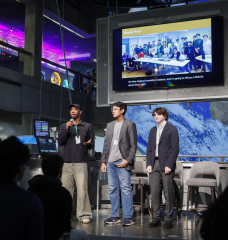 Langston Reid, Vishnu Bharath, and Simon Zall (left to right) discuss their project at the 2024 Day of AI global celebration at the Museum of Science. Day of AI is a free, hands-on curriculum developed by the MIT Responsible AI for Social Empowerment and Education (RAISE) initiative.