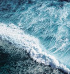 Aerial photograph of an ocean wave crashing