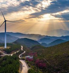 Wind turbine with sunset in background