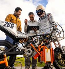 Electric Vehicle Team members (from left to right) Anand John, Rachel Mohammed, and Aditya Mehrotra '22, SM '24 monitor their bike’s performance, battery levels, and hydrogen tank levels to estimate the vehicle’s range.