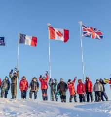 Scientists participating in Operation Ice Camp 2024 display flags representing their countries. 