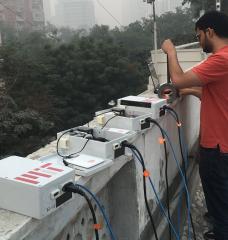 Graduate student Sidhant Pai repairs low-cost air quality sensors near Connaught Place in Central Delhi.